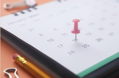 Image of a calendar with a thumb tack on 15 of a month